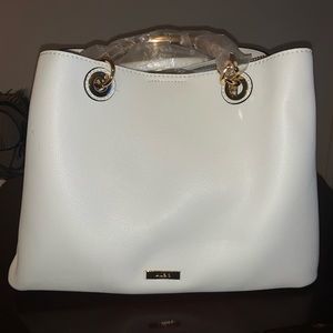 Never worn white Aldo purse. Tags still on the purse.